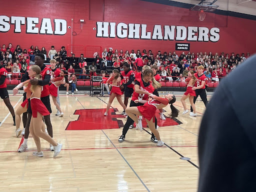 Senior captain of the dance team Lily Rivera dances with senior football player Jayson Burris