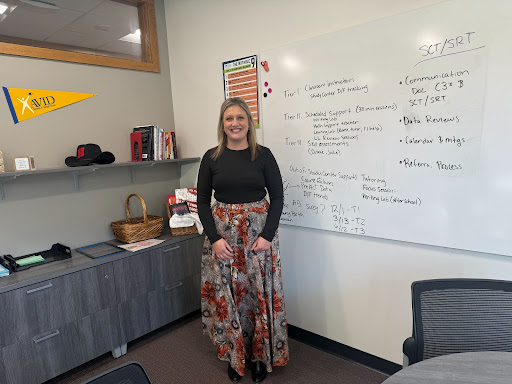 Ms. Charles works in her office.
