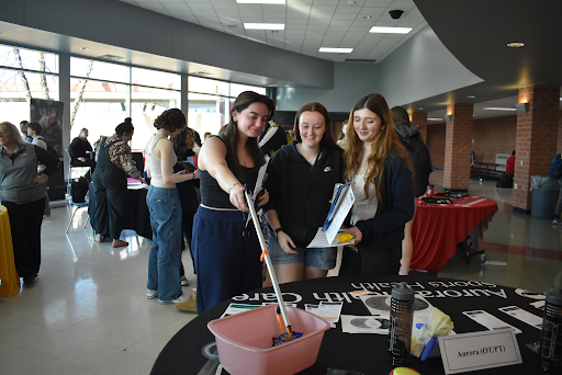
Juniors Mel Franklin, Samantha Holtmeier, and Evan Fantin engage with a Career Fest table.