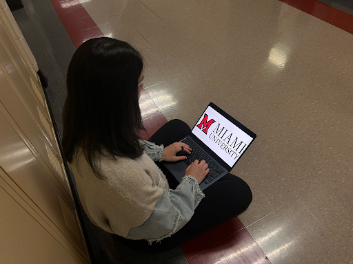 Ella Endres, senior, looks at the University of Miami of Ohio logo after committing. 