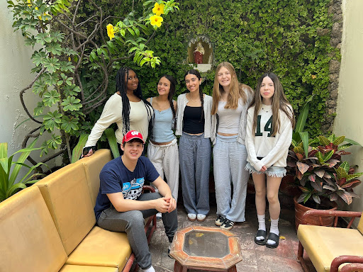 Aniyah Love, David Ustanisky, Helena Frets, Kiran Albert, Alexandra Stern, and Emily Champion pose for a group photo during their trip