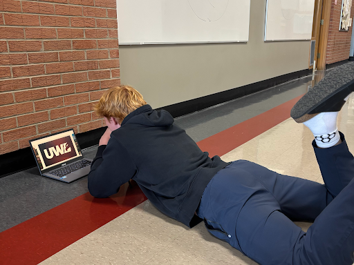 Brady Stammer, senior, admires his future college on his computer.
