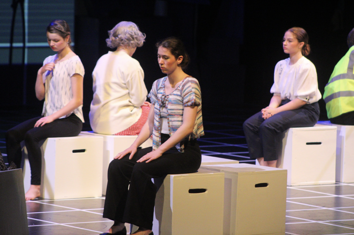 Addison Drumm, senior, sits in thought during the production of The Curious Incident of the Dog in the Nighttime.